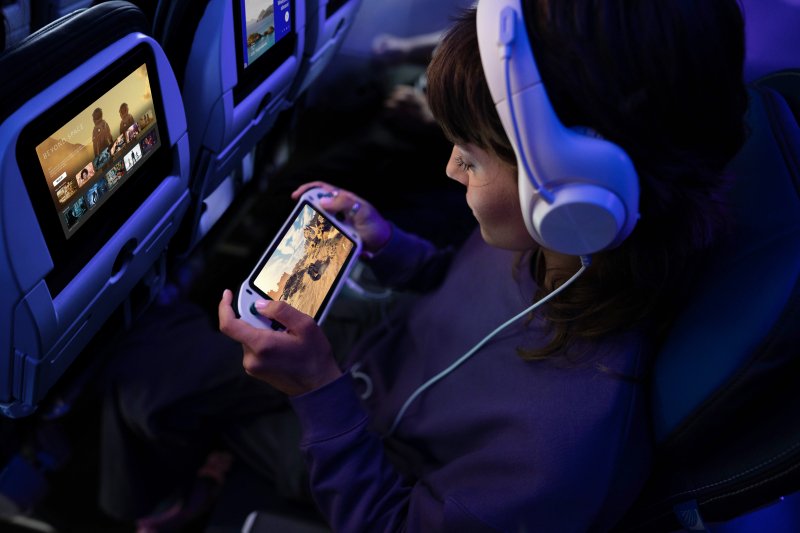 United Airlines passenger viewing video content streamed via Starlink